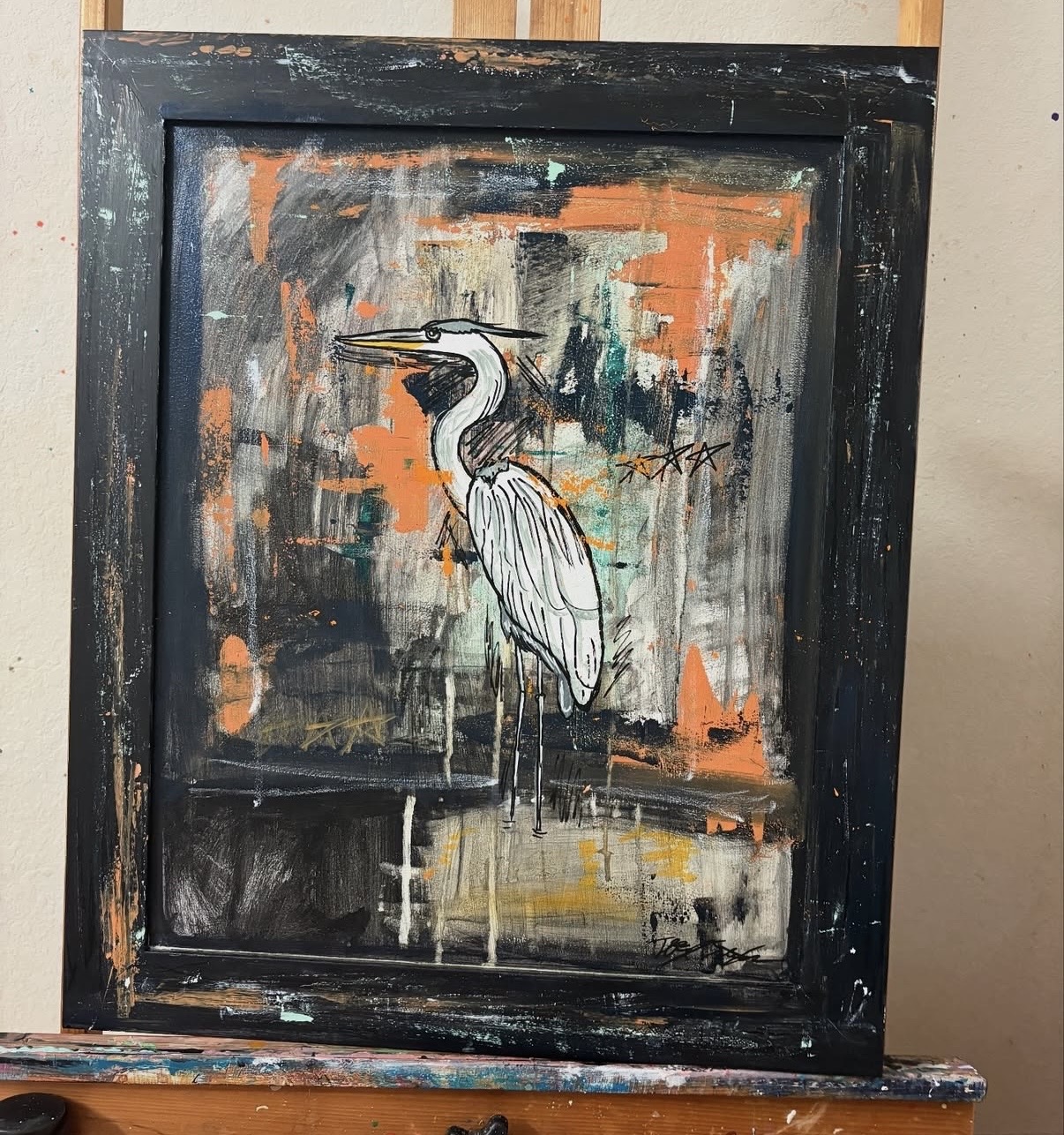 Painting of a heron with a black frame, abstract background with orange, gray, and black colors.