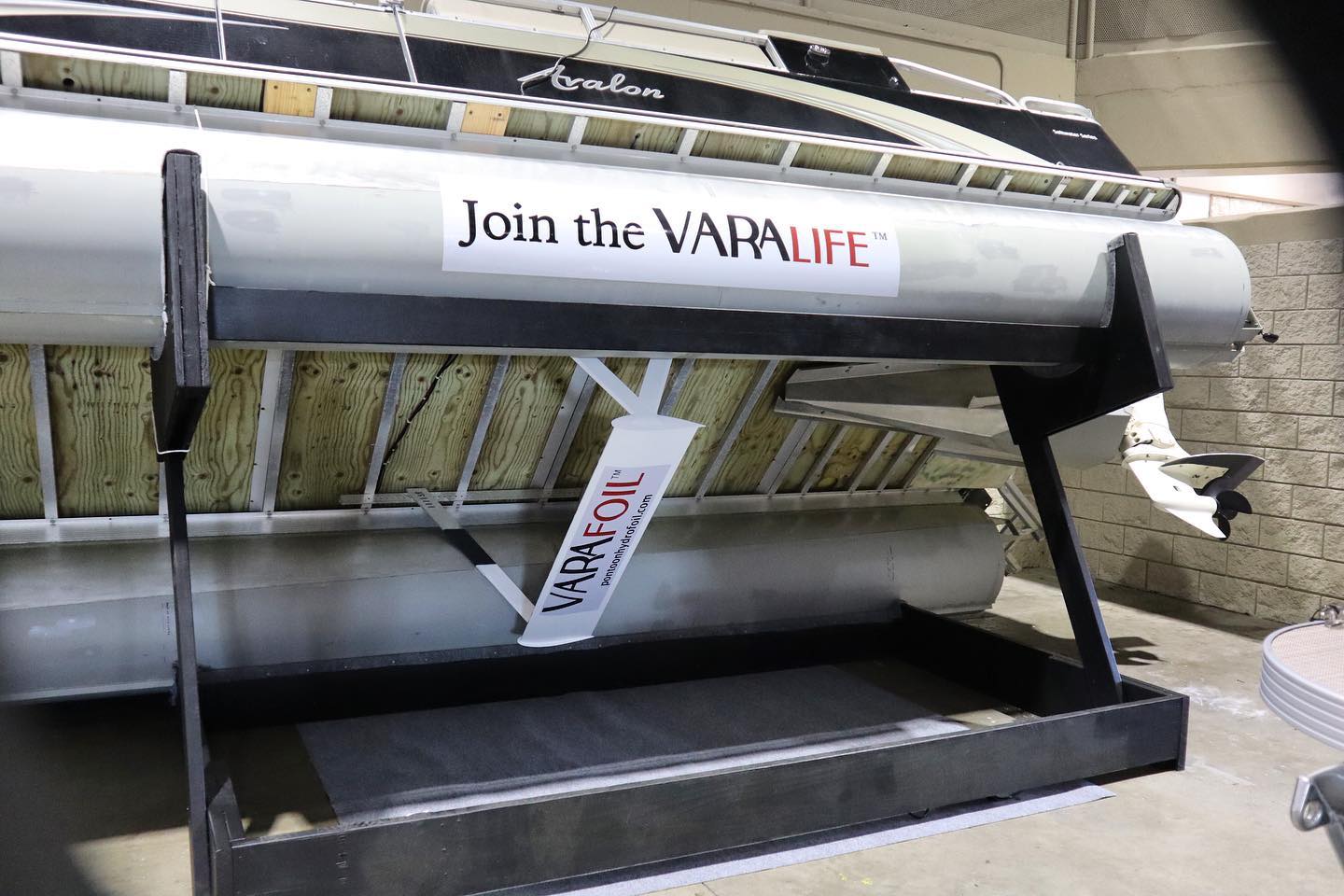 A missile with a sign reading 'Join the VARALIFE' is displayed on a stand indoors.