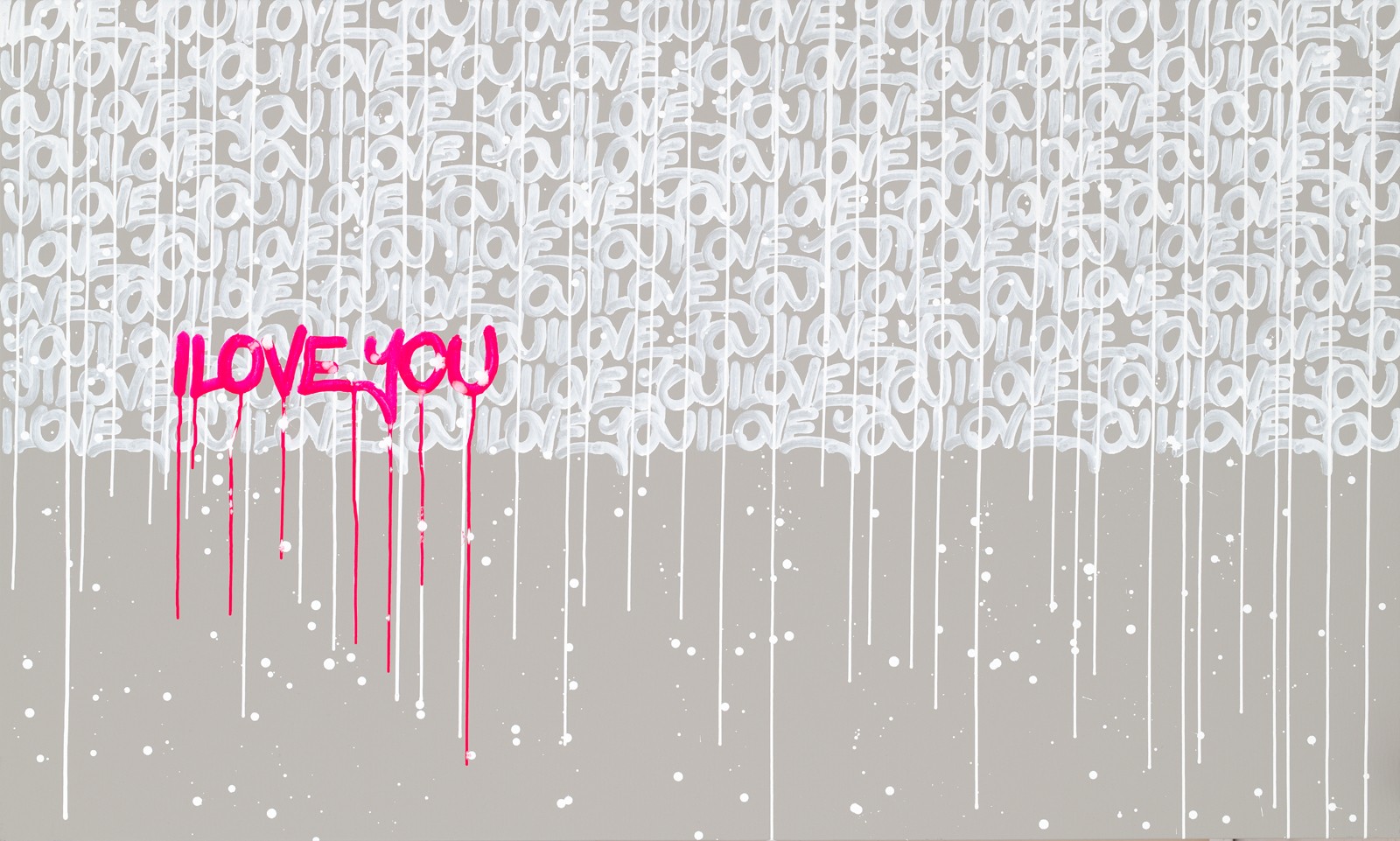 Graffiti with pink text saying 'LOVE YOU' on a background of white and gray abstract patterns.