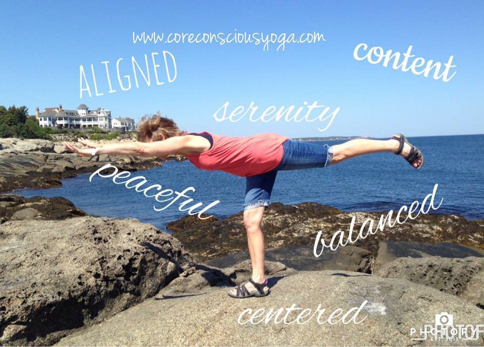Person balancing on rocks near water, arms and leg extended, with words like aligned, serenity, peaceful, content, balanced, centered floating around.