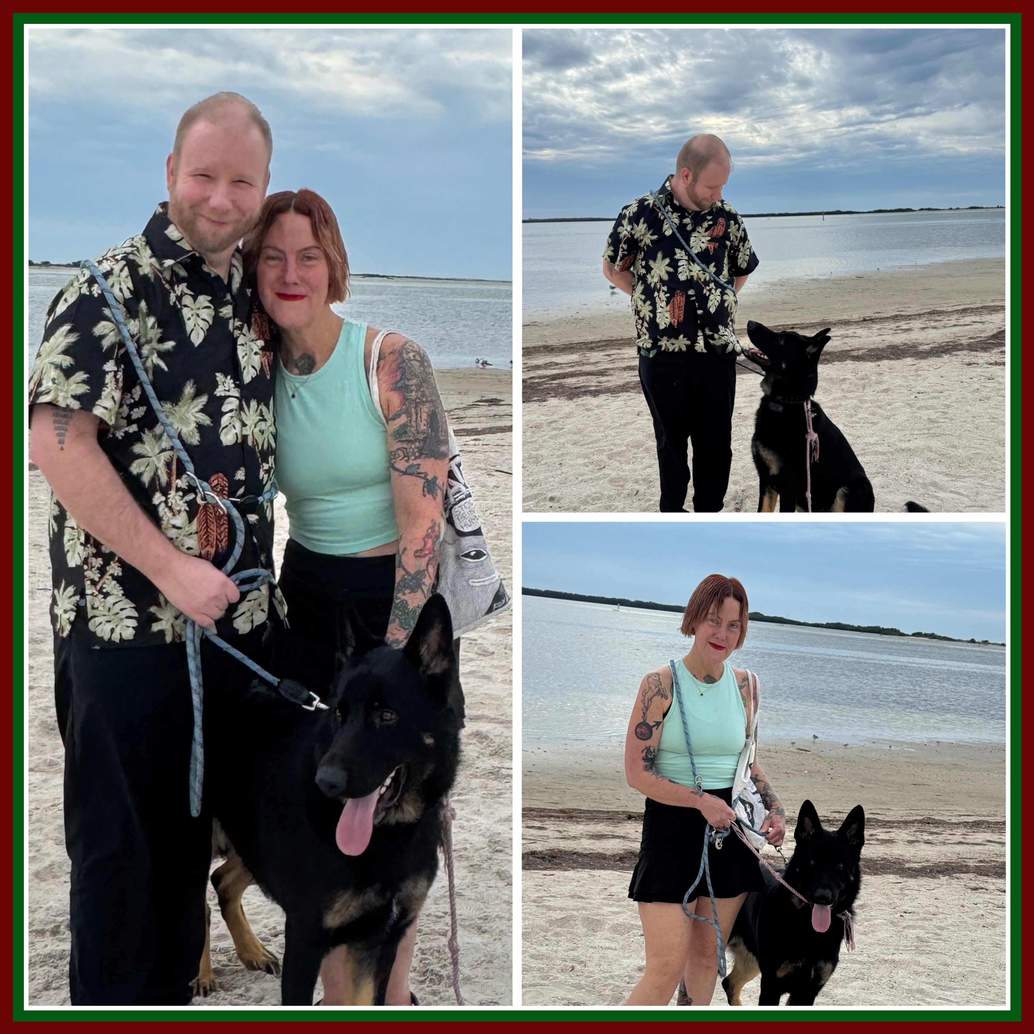 Three people with a black dog on a beach, two standing and one sitting, with water and sky in background.