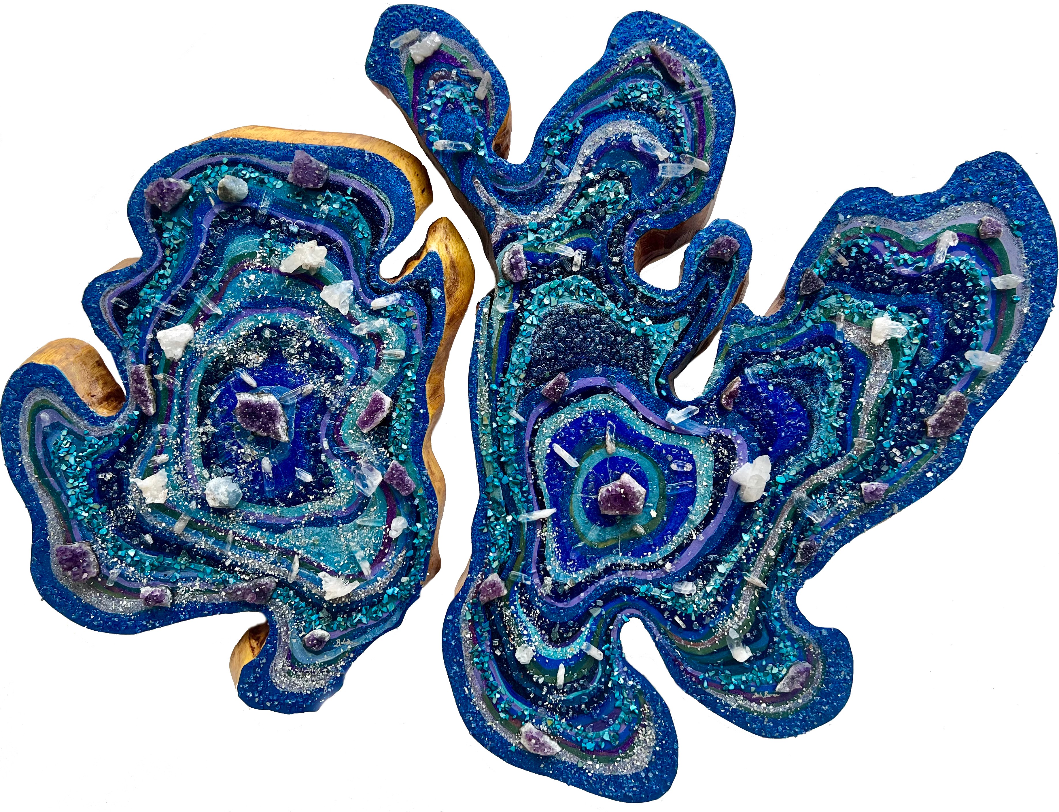 Two blue and silver abstract art pieces with swirling patterns and glitter, resembling stylized butterflies or organic shapes.