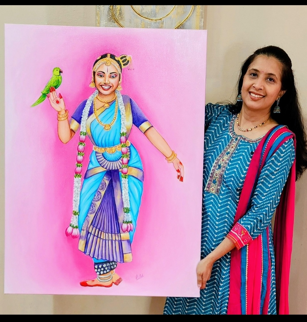 Woman standing next to a colorful painting of a woman in traditional attire with a parrot, smiling, indoors.