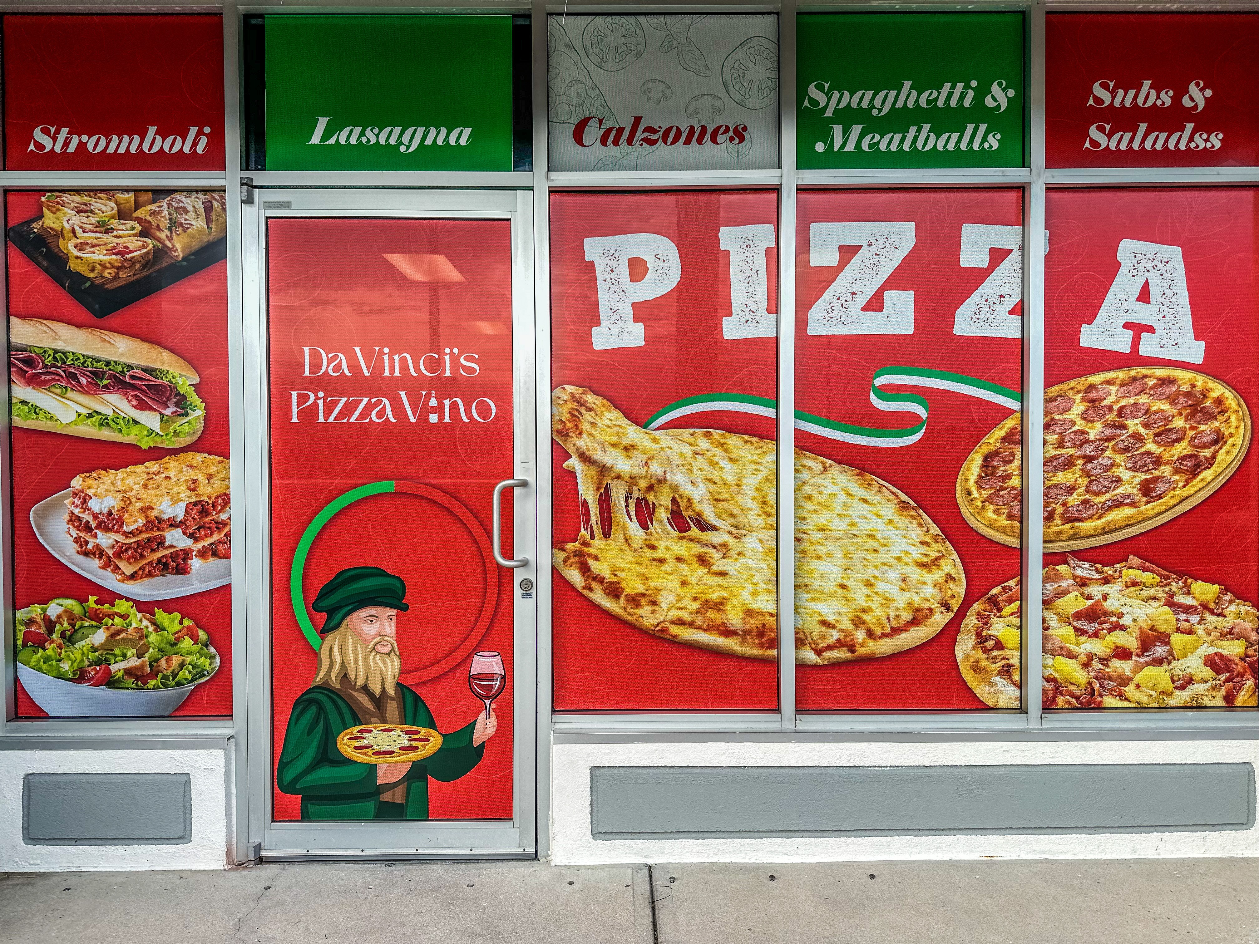Pizza restaurant storefront with menu items and a door featuring a chef holding a pizza, colorful signs, and images of pizza slices.