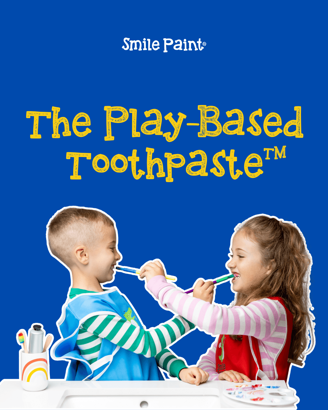 Two children, a boy and a girl, pretend to brush each other's teeth with toothbrushes, smiling at each other, against a blue background.